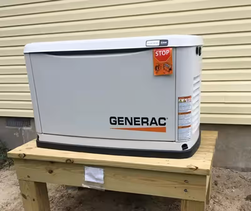 New Generac backup generator installation on wooden platform.